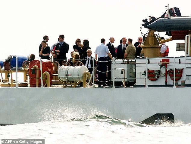 Senator Ted Kennedy (right, wearing sunglasses) and other members of the Kennedy family were taken to the USS Briscoe to scatter the ashes