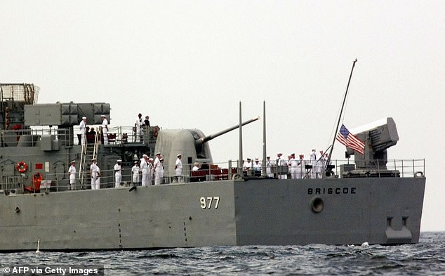 The flag is flying at half-mast aboard the Navy destroyer USS Briscoe