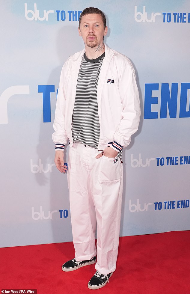 Professor Green looked effortlessly cool for the event in a white tracksuit which he paired with a striped T-shirt and black trainers