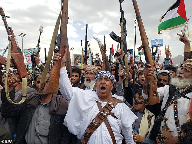 The Yemen-based Houthi group has targeted shipping in the Red Sea and Gulf of Aden over the past nine months, claiming its actions are a direct response to Israel's war on Hamas in Gaza. Pictured: Houthi supporters in May