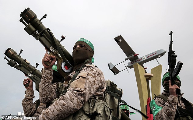 Pictured: Members of the terrorist group Hamas wearing green headbands