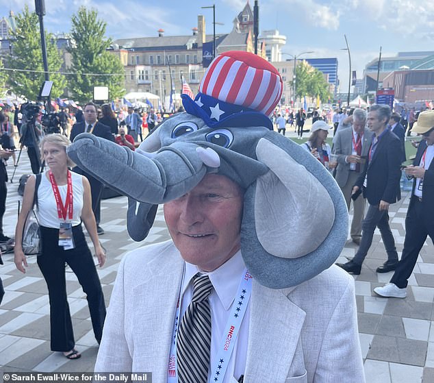 Rep. Hank McCain wears an elephant hat outside the convention on Day 2