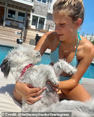 Her 14-year-old daughter, Bryn, was also seen joining her mom for the relaxing summer day and cuddling up with an adorable pup