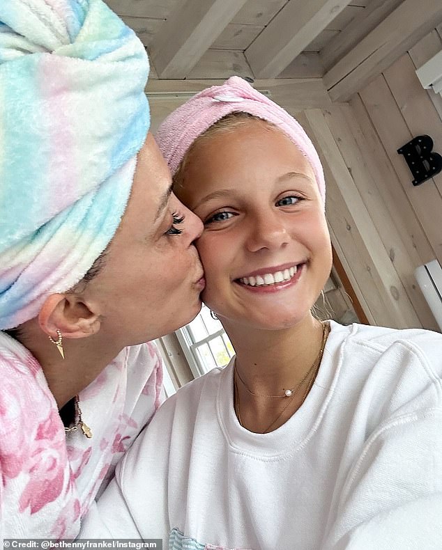 Finally, the reality star posted a photo to the Instagram carousel of herself giving her daughter a kiss on the cheek, who flashed a cheerful smile for the camera