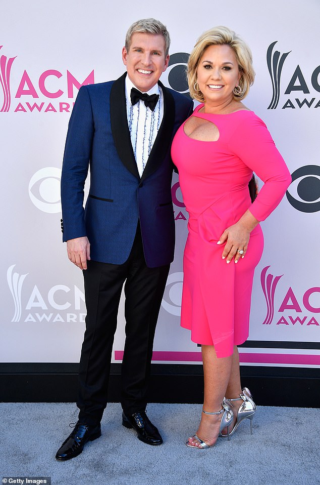 The 26-year-old reality star turned podcast host delivered a speech criticizing the prosecution and conviction of her parents, who were initially sentenced to a combined 19 years in federal prison; Todd and Julie Chrisley pictured in Las Vegas in 2017