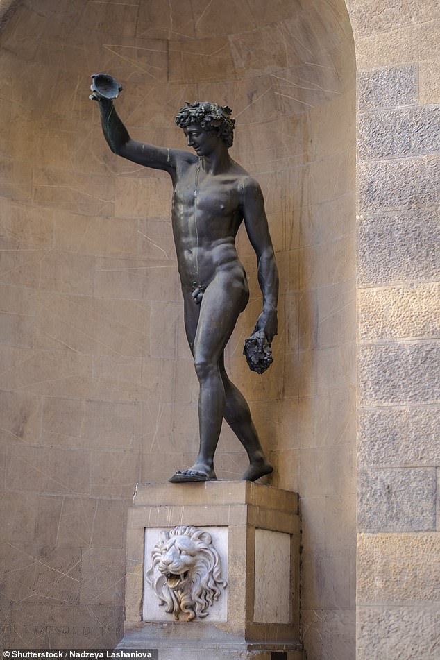 The statue the woman in the photo is standing with is a replica (pictured above) of the original bronze Bacchus, made by Giambologna in the 1560s and housed in the Bargello Museum.