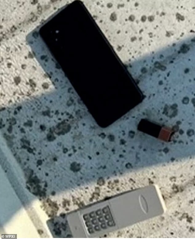 The remote detonator can be seen next to Thomas Crooks' cell phone