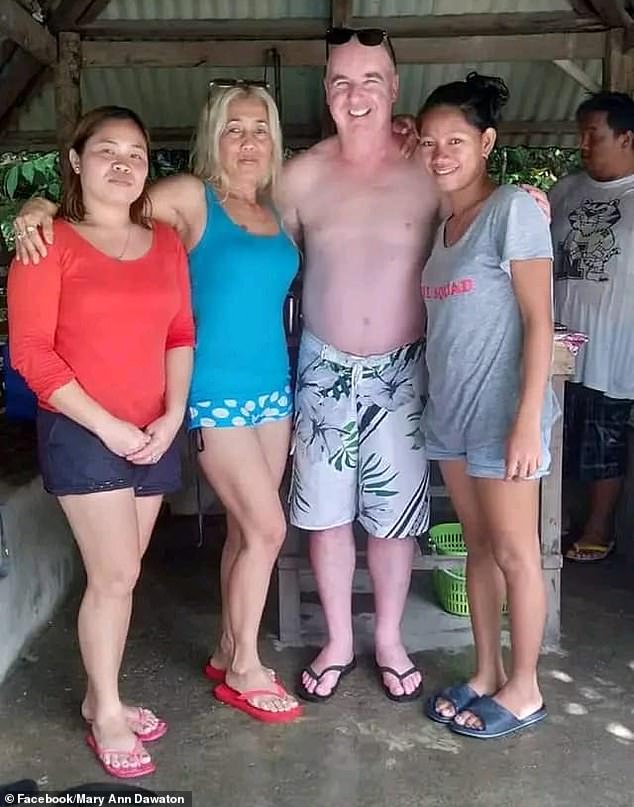 The three murder victims are pictured left and center, along with another family member (right) during Mr. Fisk's visit to the Philippines with his partner Lucita Barquin Cortez