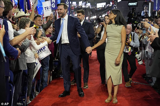 Senator Vance with his wife Usha as they arrive on the floor during the first day of the Republican National Convention after he was chosen as Trump's running mate