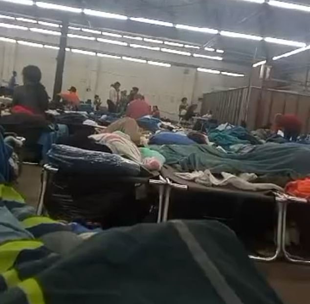 Migrants pictured at a makeshift shelter in Chicago's Pilsen neighborhood, where many are being relocated. There has been an outbreak of measles and tuberculosis linked to the shelter