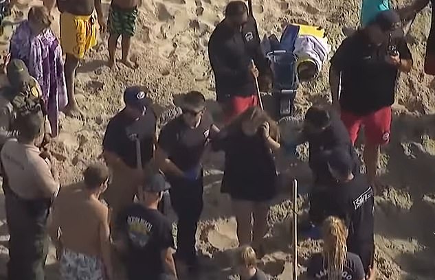 Witnesses described the terrifying scene as the teen found herself buried 6 to 8 feet deep as the sand collapsed around her, leaving only her head and arms exposed