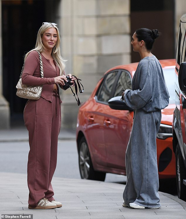 The beauty completed her look with a pair of rectangular sunglasses and carried her essentials in a quilted gold Chanel flap bag.