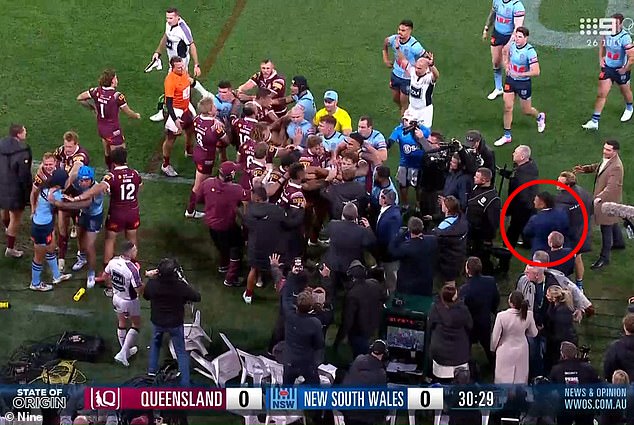 In sensational scenes, NSW's 19th man Haumole Olakau'atu (pictured right, circled in red) was sent off the touchline at Suncorp Stadium after being involved in a first-half brawl