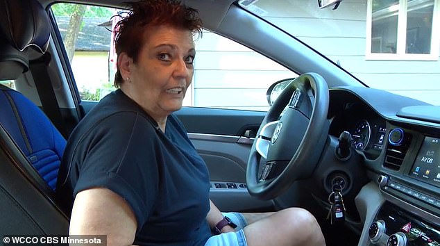 Walters is pictured in her car, the first new vehicle she's been able to purchase in 30 years