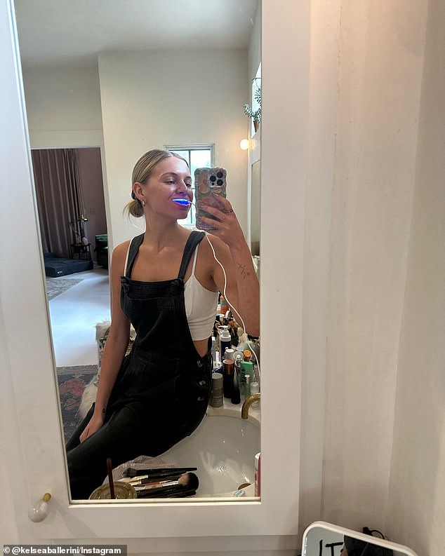 The fifth slide was another selfie from her new judge's chair on the set of The Voice and the sixth was a mirror selfie while she was using a teeth whitening machine