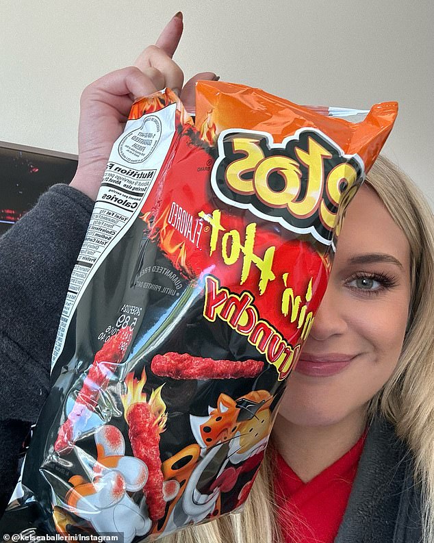 In the last photo she is seen holding up a bag of Flamin' Hot Cheetos