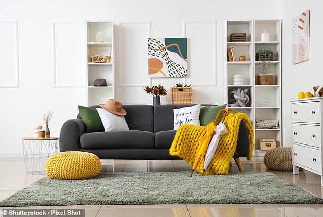 The yellow plaid and the ottoman add a lively touch to this boring living room (stock image)