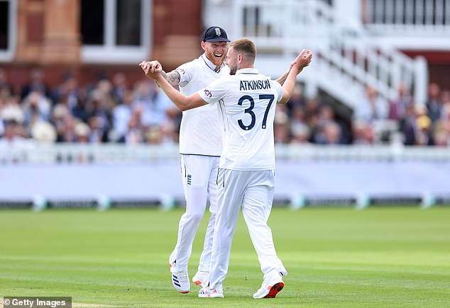 Atkinson pictured with Ben Stokes after taking the wicket of West Indies' Shamar Joseph on the first day of the first Test, one of his twelve on debut