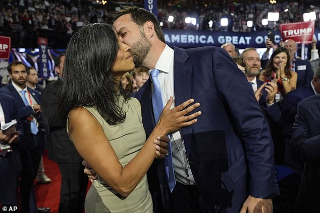 Republican vice presidential nominee J.D. Vance kisses his wife Usha on the convention floor in Milwaukee on Monday as he is officially nominated for the GOP slate