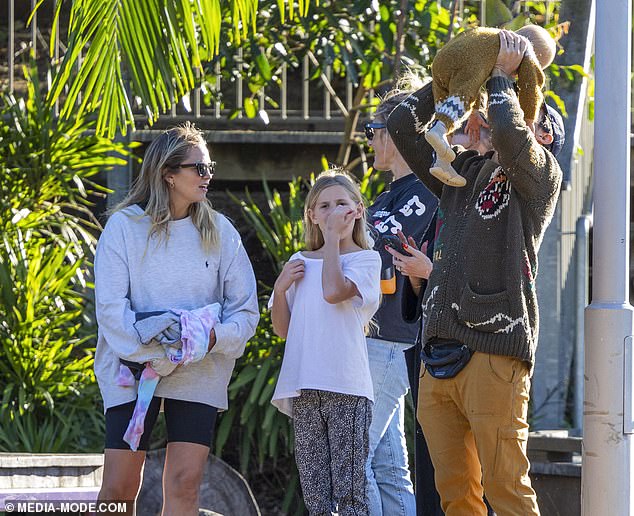 Adrian, who is in Australia filming his documentary series 'Earth Speed', kept warm in brown trousers and a green sweater