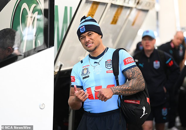 The NSW winger had a superb State of Origin series for the Blues and didn't seem keen on changing into street clothes as he boarded the team bus on Thursday (pictured)