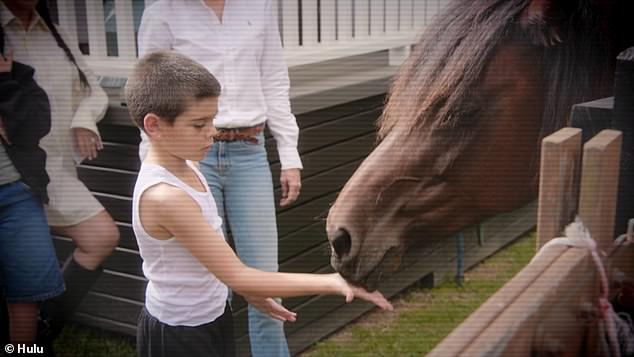 We see Reign feeding a horse a carrot, while Kourtney asks Reign and Penelope about their 