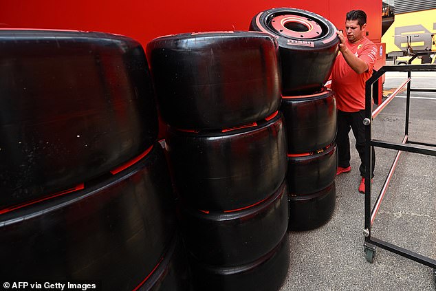 A Ferrari team member checks the team's Pirelli tires at the Hungarian race circuit in Mogyorod, near Budapest