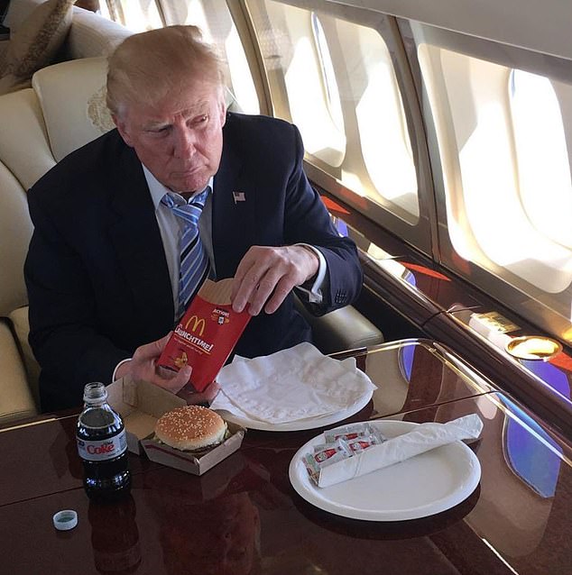 Donald Trump is pictured above enjoying a McDonald's and a Diet Coke on his private jet in 2016, celebrating after winning the Republican Party nomination.