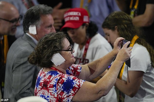 Many reportedly tied the bandages around their heads after some people handed them out at the conference.