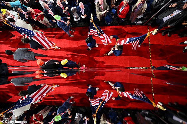 UNC Frat Boys carry the American flag on the third day of the Republican National Convention at Fiserv Forum on July 17, 2024