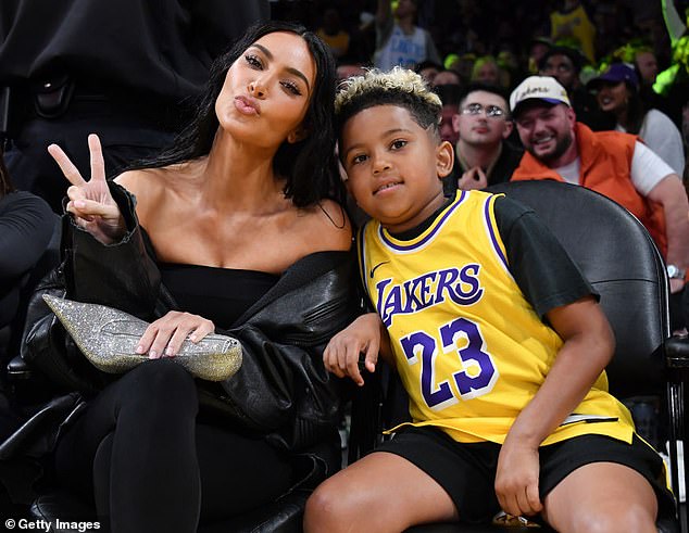 Kim and her eldest son, Saint, at a basketball game in December