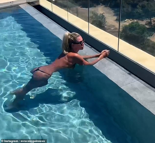 Sharing the video montage on her Instagram, Christine looked incredible as she swam topless in a pool