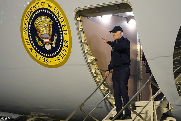 President Joe Biden disembarks from Air Force One on Wednesday evening after returning from Las Vegas, where he was diagnosed with COVID-19.