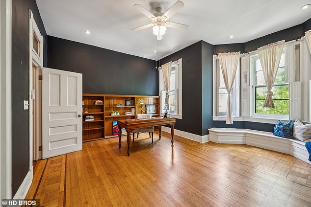 The bedrooms are all painted in dark colours and have the same beautiful hardwood floors