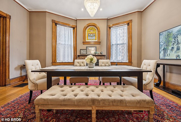 The taupe-colored dining area also features large windows and a fireplace. Some of Baltimore's most prominent residents have been welcomed inside and philanthropic fundraisers have been held here