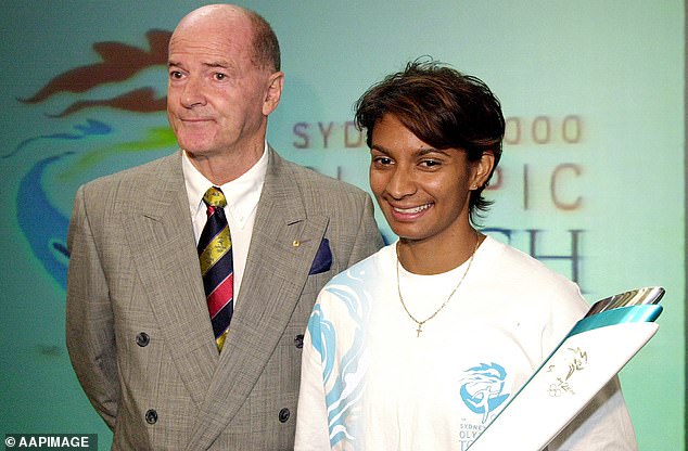 The renowned sports administrator (pictured with Australian Games star Nova Peris in 2000) was a driving force behind the huge success of the Sydney Olympics