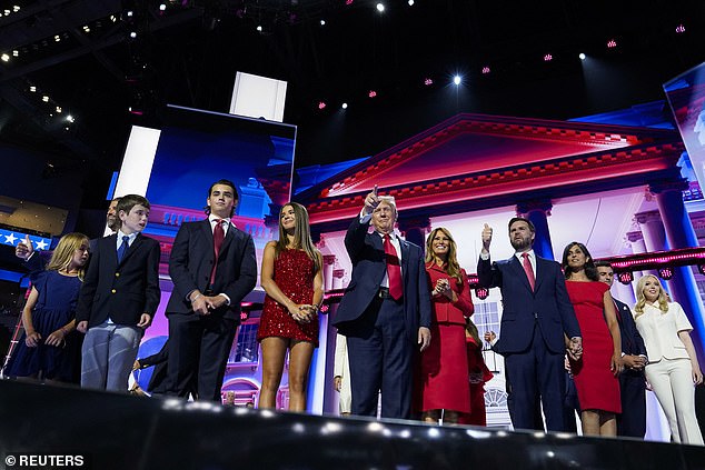 Onald Trump gestures as he is joined onstage by his wife Melania, Republican vice presidential nominee J.D. Vance and family members