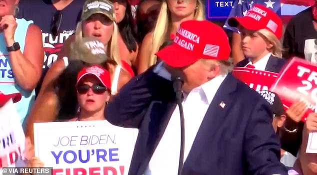 Trump's turning his head to the right to look at the graph on the screen during his rally is credited with saving his life, as the bullet that hit his ear was inches away from a much deadlier impact.