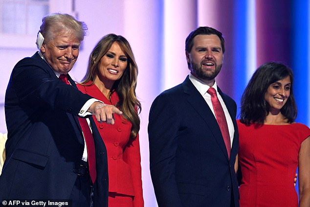 The former first couple and their running mates pose together on stage after the speech