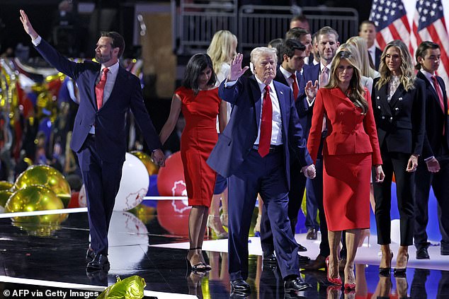 Former U.S. President and 2024 Republican presidential candidate Donald Trump (C), along with former U.S. First Lady Melania Trump (R), U.S. Senator from Ohio and 2024 Republican vice presidential candidate J.D. Vance (L) and his wife Usha Vance (2nd from left), walk off the stage after accepting their party's nomination on the final day of the 2024 Republican National Convention