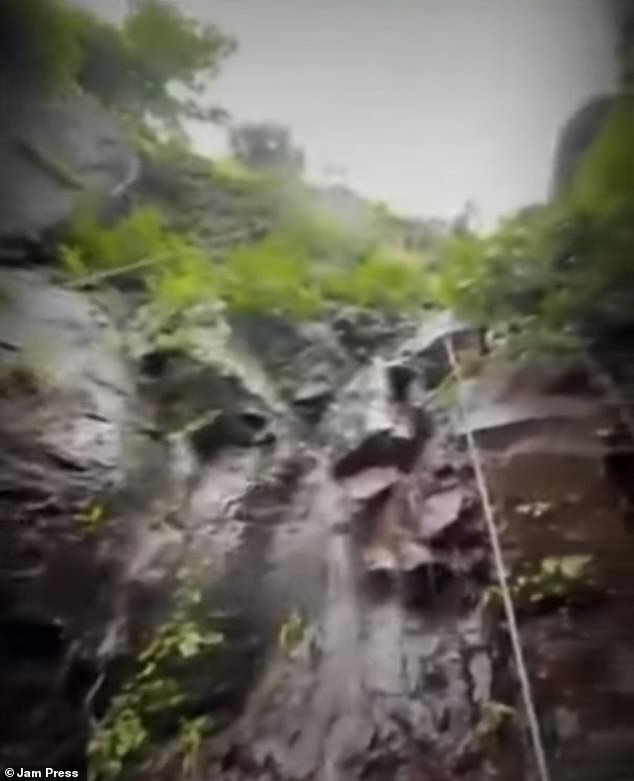 The content creator was filming an Instagram video with six friends when she slipped and fell from the waterfall (pictured), which happened during the local monsoon season