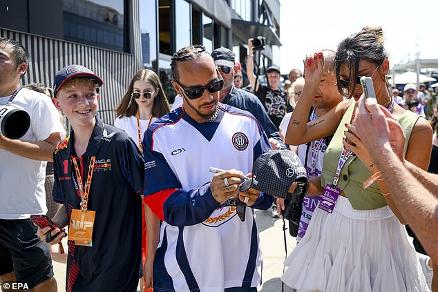 Lewis also stopped to sign some autographs for a few lucky fans as he walked to the paddock