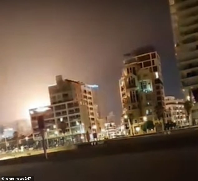 An orange glow can be seen at the site of the explosion that left one dead and ten injured