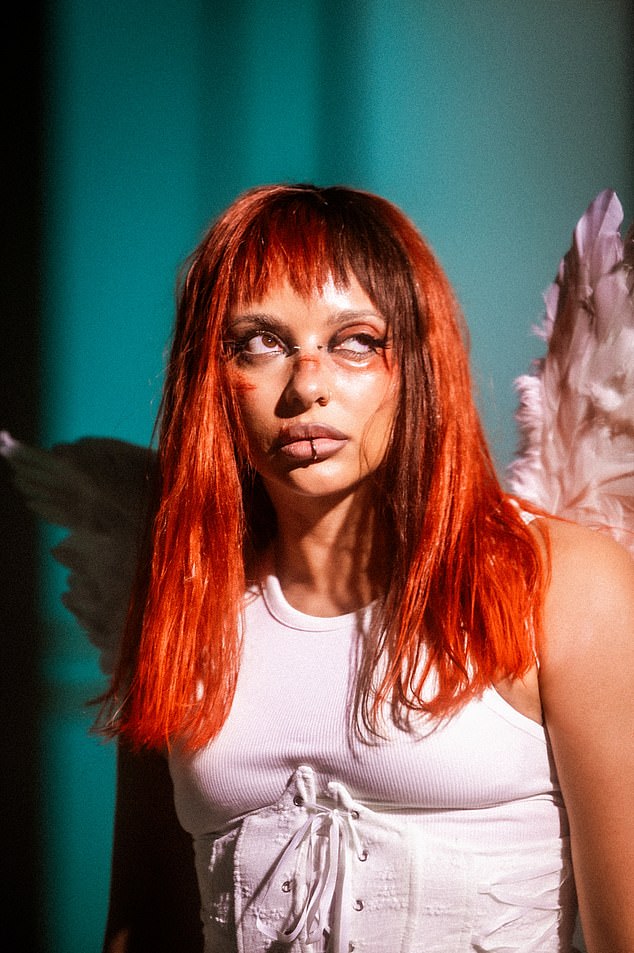 And Jade didn't hold back in the music video as she explored a new side of her music style outside of the band, styling a red-haired fringe in the music video