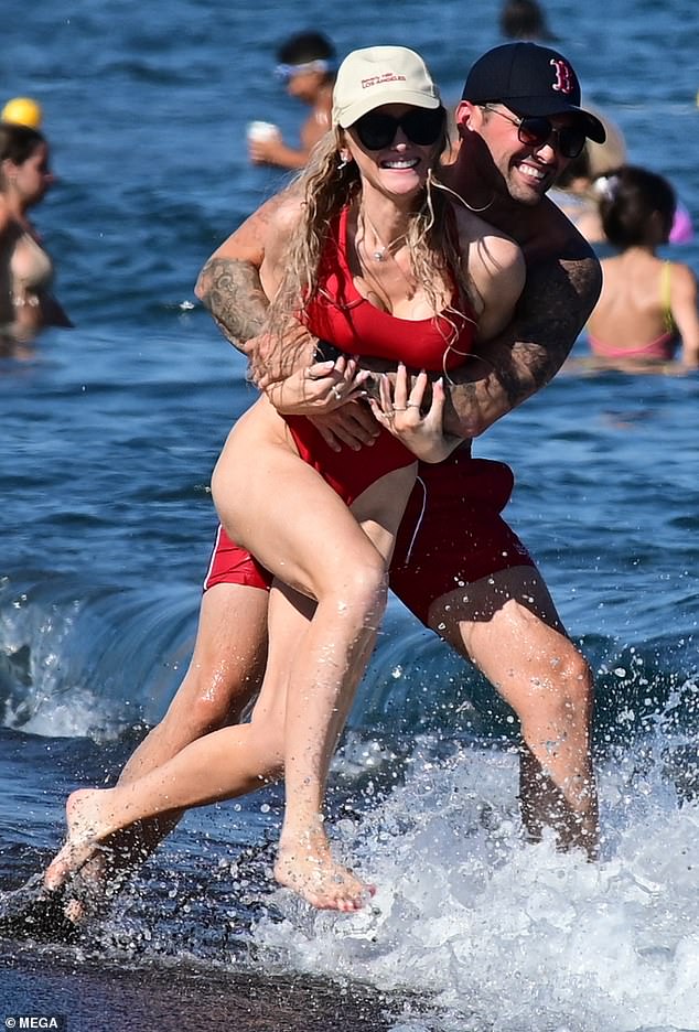 Ricky couldn't keep his hands off his gorgeous girlfriend, they both wore red swimsuits