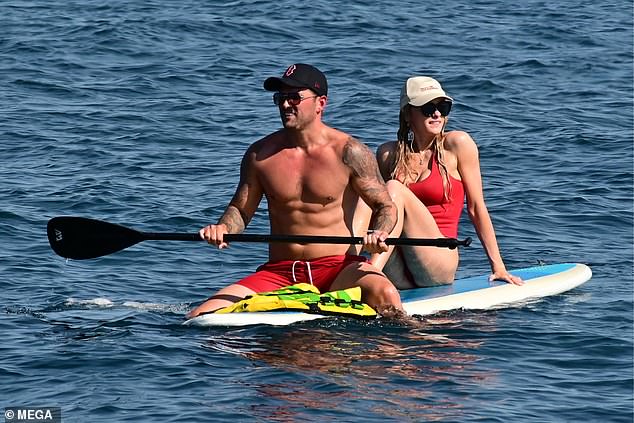 The lovebirds enjoyed a spot of paddleboarding while topping up their tans