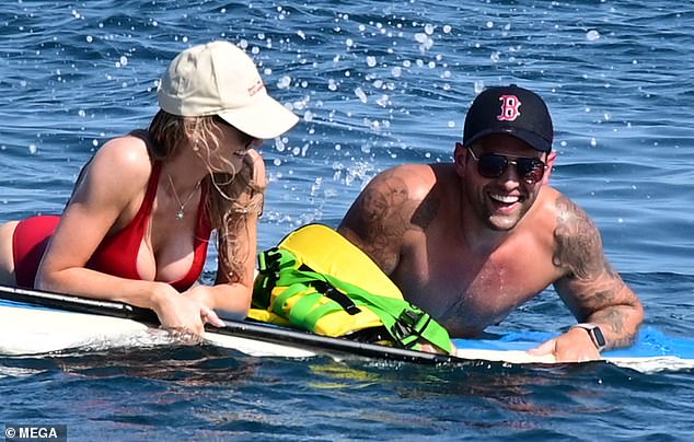 The couple chats intensely while on the water