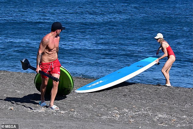 Later they dragged their board across the sand