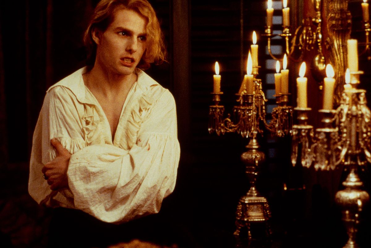 Tom Cruise as Lestat wears a pleated white low-cut shirt