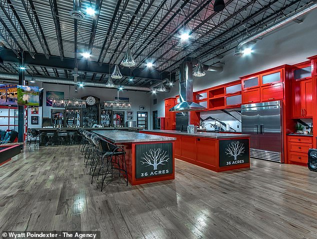 The barn has a large space for making and eating food and is equipped with bright red cabinets